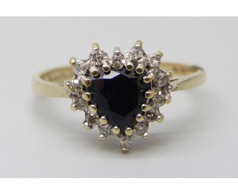 A 9ct gold ring with set with a heart shaped sapphire stone and diamond cluster, 1.8g, O