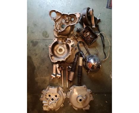 A collection of Norton spares including ES2 cases, Dominator cases, a pair of Thunder Engineering con rods, Tickle headlamp b