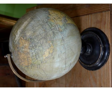 Small Phillips British Empire globe on turned wood stand 