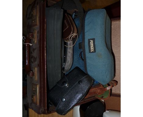 Small leather suitcase containing Fujica ST701 camera with lenses, Western Master Four light meter, Kodak Brownie etc.