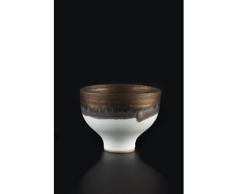 Lucie Rie (British, 1902-1995) Footed bowl, circa 1981 porcelain, matte white glaze with golden manganese lip impressed potte