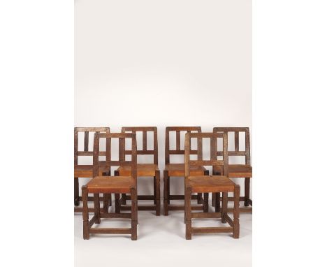 Robert Thompson of Kilburn (British, 1876-1955) Mouseman set of six chairs oak, slat backs, leather seats, on octagonal front