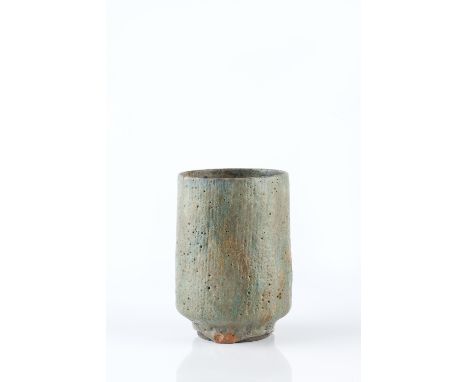 Lucie Rie (British, 1902-1995) Vase mottled green glaze and incised vertical lines impressed potter's seal 13cm high.