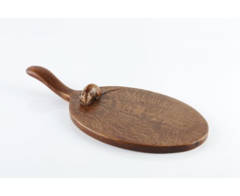 Robert Thompson of Kilburn (British, 1876-1955) Mouseman cheeseboard oak carved mouse to the board 37cm long.