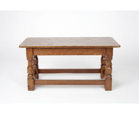 Robert Thompson of Kilburn (British, 1876-1955) Mouseman table oak, four octagonal legs carved mouse 40cm high, 84cm across.