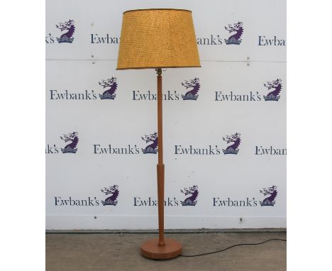1960s turned teak standard lamp, with circular base, 121 cm high