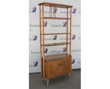 Ercol light elm Giraffe room divider bookcase, with adjustable shelves over a pair of cupboard doors, on turned legs, H191.5 