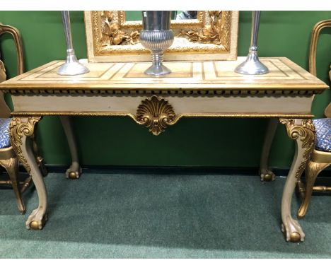 A GILT DETAILED CREAM GROUND CONSOLE TABLE, THE RECTANGULAR TOP OVER A SHELL CENTRED APRON AND CABRIOLE LEGS ON BALL AND CLAW