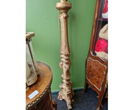 A PAIR OF GILT WOOD PRICKET CANDLE STICK STANDARD LAMPS, EACH OF TRIANGULAR SECTION AND ON THREE SCROLL FEET.   H 150cms.