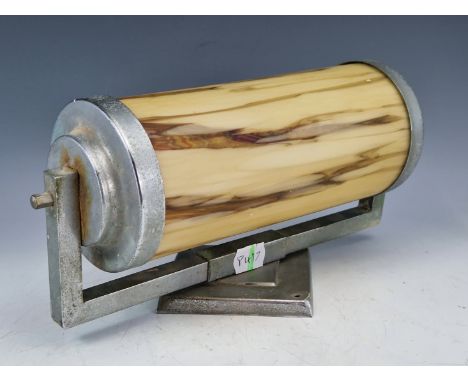 AN ART DECO CHROME AND MOTTLED BROWN GLASS CINEMA LIGHT, THE METAL ENDS SUPPORTING THE CYLINDRICAL SHADE JOINED TO A DIAMOND 
