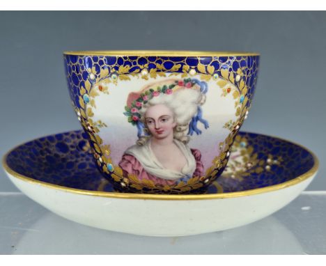 A SEVRES JEWELLED CUP AND SAUCER, THE FORMER PAINTED WITH A PORTRAIT OF A LADY, THE LATTER WITH FLOWER RESERVES, THE GOLD CAI