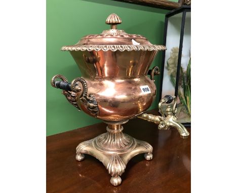 A VICTORIAN COPPER EPERGNE WITH TWO HANDLES FLANKING THE BRASS SPIGOT ABOVE THE BASE ON FOUR BUN FEET.   H 43cms.