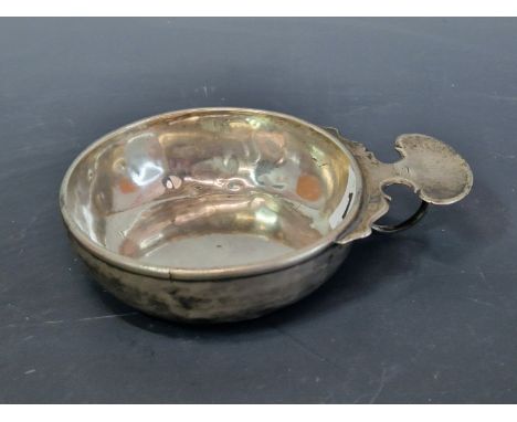 A FRENCH SILVER TASTEVIN, THE RING HANDLE WITH KIDNEY SHAPED THUMB PIECE, THE SIDES INSCRIBED LOVIS LANDAIS, 103Gms. 