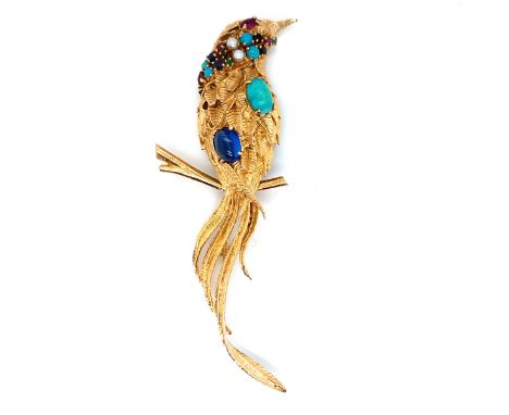 A LARGE GEM SET BIRD PERCHED ON STYLISED BRANCH. THE BIRD SET WITH A VARIETY OF GEMSTONES TO INCLUDE TURQUOISE, RUBY, EMERALD