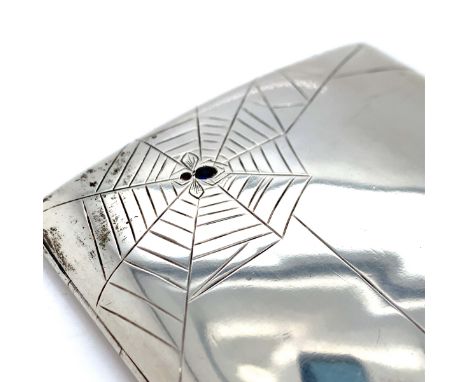 AN ANTIQUE GEMSET CIGARETTE CASE. THE FRONT COVER DECORATED WITH A SPIDERS WEB, COMPLETE WITH A GEMSET SPIDER AND FLY CAUGHT 