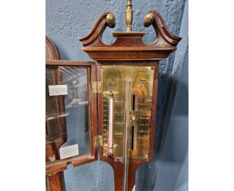 THOMAS WRIGHT OF SARUM, A MAHOGANY STICK BAROMETER WITH AN ALCOHOL THERMOMETER TO ONE SIDE OF THE BRASS DIAL, THE RESERVOIR T