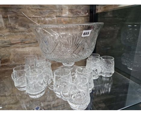 AN EDINBURGH CRYSTAL PUNCH BOWL RAISED ON A STAR CUT FOOT AND WITH TWELVE MUGS CUT EN SUITE, THE BOWL.   Dia. 30cms. TOGETHER