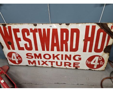 A WHITE GROUND ENAMEL SIGN INSCRIBED IN RED FOR WESTWARD HO SMOKING MIXTURE.   127 x 58cms.