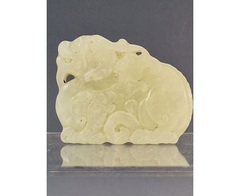 A CHINESE NEPHRITE JADE PENDANT CARVED AS A RECLINING QILIN. W 5cms.