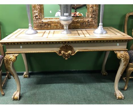 A GILT DETAILED CREAM GROUND CONSOLE TABLE, THE RECTANGULAR TOP OVER A SHELL CENTRED APRON AND CABRIOLE LEGS ON BALL AND CLAW