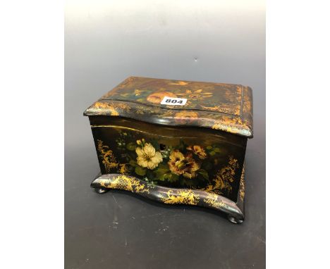 A 19th C. PAPIER MACHE TWO COMPARTMENT TEA CADDY PAINTED AND GILT WITH FLOWERS AND CONTAINING PLASTIC COUNTERS, THE CADDY.   