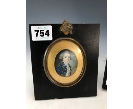 AN 18th C. PORTRAIT MINIATURE OF A GENTLEMAN WEARING A BLUE JACKET TOGETHER WITH ANOTHER LATER OF AN ELIZABETHAN LADY