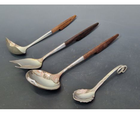 A GEORG JENSEN STERLING SILVER SAUCE LADLE TOGETHER WITH THREE WOODEN HANDLED STERLING SILVER SERVING UTENSILS BY COHR, DENMA