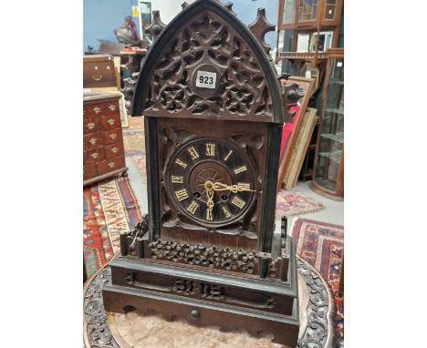 A CUCKOO CLOCK, THE CASE OF CHALET FORM, THE MOVEMENT STRIKING ON A COILED ROD, THE CASE.   H 56cms.