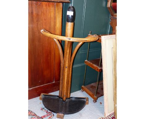 A BENTWOOD STICK STAND WITH REMOVABLE IRON DEMILUNE TROUGH BASE