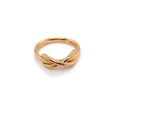 A TIFFANY &amp; CO, 18ct YELLOW GOLD INFINITY RING. FINGER SIZE J. WEIGHT 4.22grms. 