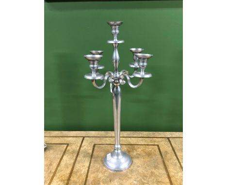 A PAIR OF ALUMINIUM FIVE LIGHT CANDELABRA, THE COLUMNS ON CIRCULAR FEET.   H 79cms.