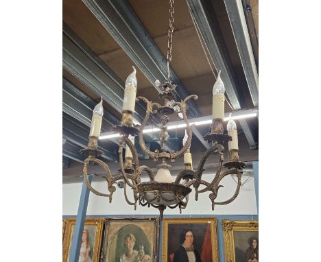 A SIX LIGHT CANDLE FORM CHANDELIER HUNG FROM HOOPED ARMS, THE CENTRAL COLUMN WITH A GLASS BOWL SHAPED BASE