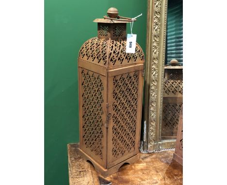 A PAIR OF IRON PRICKET CANDLESTICK LANTERNS, THE SQUARE SECTIONED SIDES PIERCED WITH SCROLLS WITHIN DIAMOND DIAPER. H 71cms.