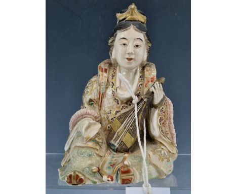 A JAPANESE SATSUMA POTTERY FIGURE OF A LADY SEATED HOLDING A LUTE.   H 16.5cms.