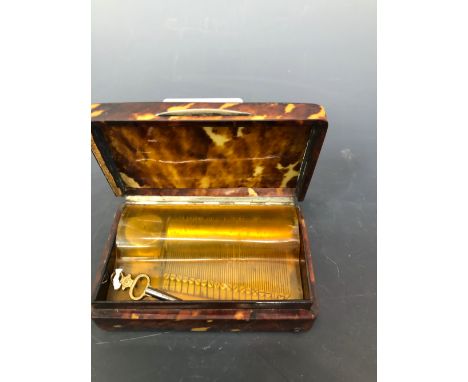 A TORTOISESHELL CASED MUSIC BOX PLAYING AIRS ON A 6cms. CYLINDER, THE RECTANGULAR BOX.   W 9cms.