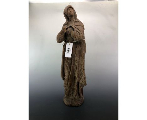 AN OAK FIGURE OF A FEMALE SAINT, POSSIBLY 18th C. GERMAN, SHE STANDS WEARING A CLOAK, HOOD AND LONG ROBES.   H 51cms.