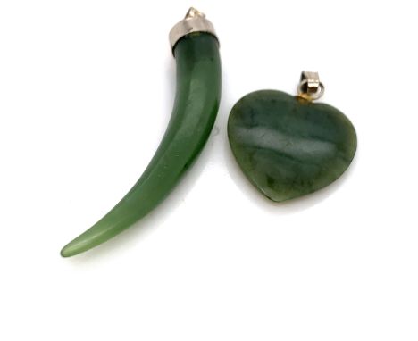 TWO NEPHRITE JADE PENDANTS, A HORN OF PLENTY AND A HEART SHAPE DROP. 