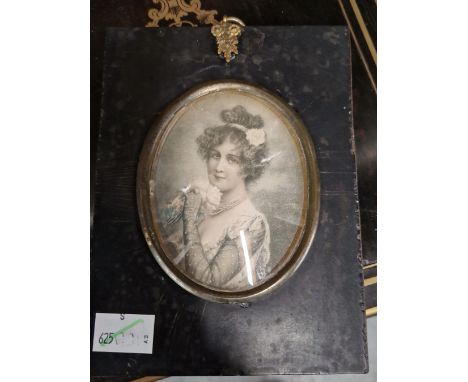 A PORTRAIT SILHOUETTE  OF A GENTLEMAN PAINTED ON GLASS TOGETHER WITH A PRINY OF A LATE 19th C. LADY IN A SIMILAR PAPIER MACHE