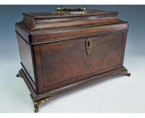 A GEORGE III EBONY LINE INLAID MAHOGANY THREE COMPARTMENT TEA CADDY WITH A SECRET COMPARTMENT TO ONE NARROW SIDE ABOVE THE OR