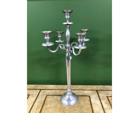 A PAIR OF ALUMINIUM FIVE LIGHT CANDELABRA WITH COLUMNS ON CIRCULAR FEET.   H 79cms.