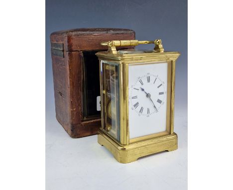 A LEATHER CASED DROCOURT CARRIAGE CLOCK STRIKING ON A COILED ROD, THE DIAL OF WHITE ENAMEL