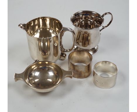 Small silver to include a christening mug, a Victorian milk jug, London, 1872 a trinket box, a small quaich and two napkin ri