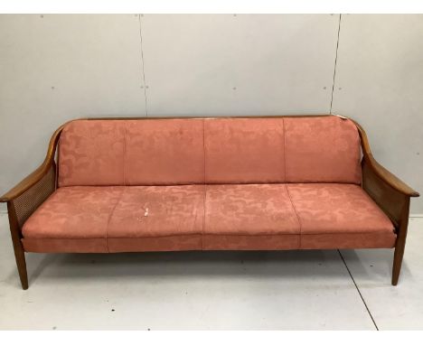 A mid century Danish design caned teak sofa bed, width 200cm, depth 75cm, height 75cm