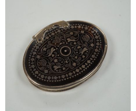 An 18th century white metal mounted tortoiseshell pique oval snuff box, 70mm.