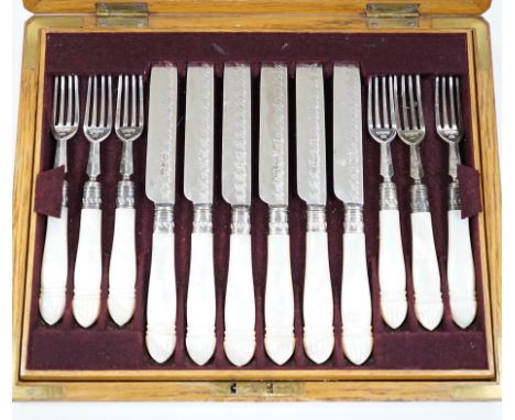 A cased set of twelve pairs of late Victorian mother of pearl handled silver dessert eaters, by Henry Harrison, Sheffield, 18