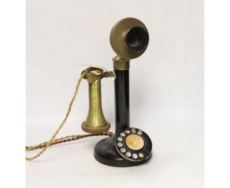 A vintage stick telephone, 32cm high