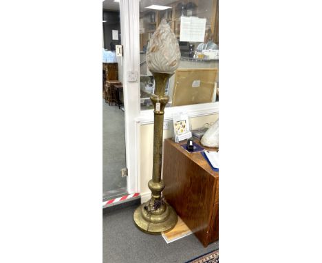 An early 20th century Indian brass floor lamp with associated opaque glass flambé shade, height 184cm