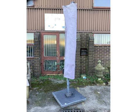 A large garden crank parasol and base