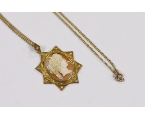 A Victorian yellow metal and seed pearl set cameo shell pendant, 40mm on a 15ct fine link chain, 44cm, gross weight 9.1 grams