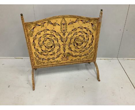 A pierced painted metal firescreen, width 80cm, height 80cm